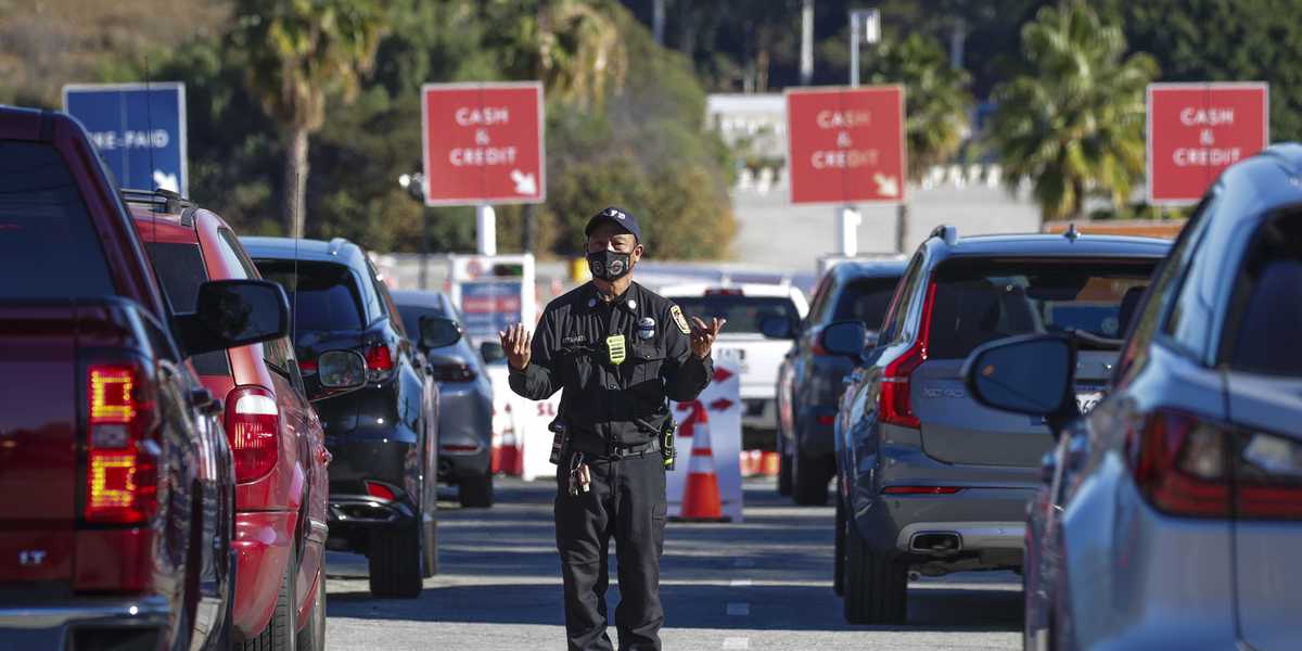 California officials decried anti-vaccination protesters who forced the temporary shutdown of the inoculation center at Dodger Stadium, stalling hundreds of motorists who had been waiting in line for hours.