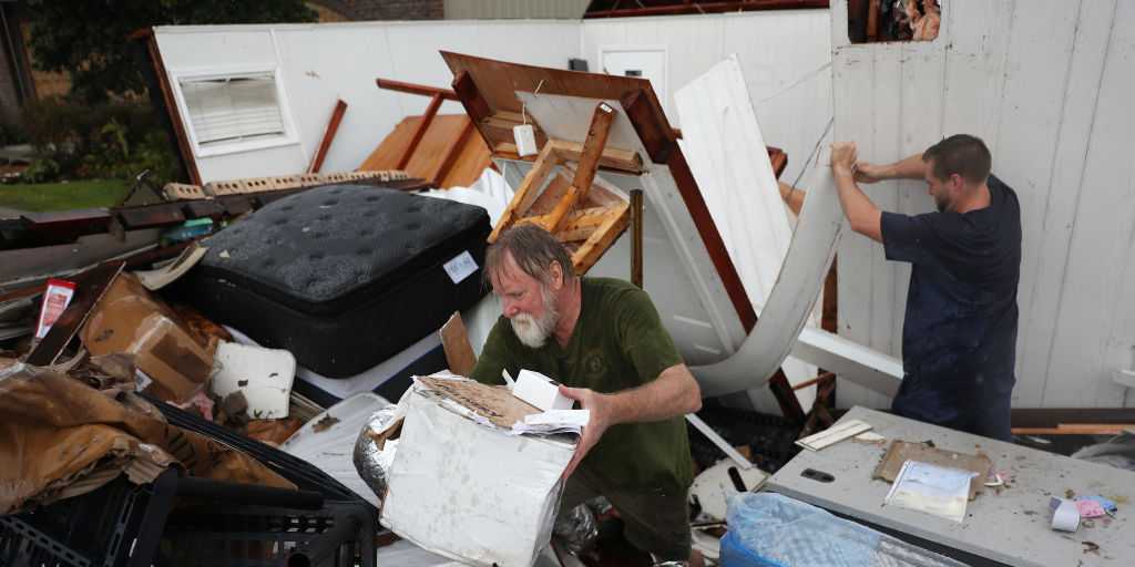 The death toll from Hurricane Laura has risen to at least 14, and hundreds of thousands of people across Louisiana are still without power or water.