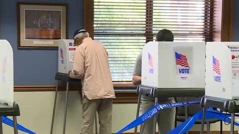 Election Live Blog: Protesters march through downtown Raleigh, chanting, burning flags